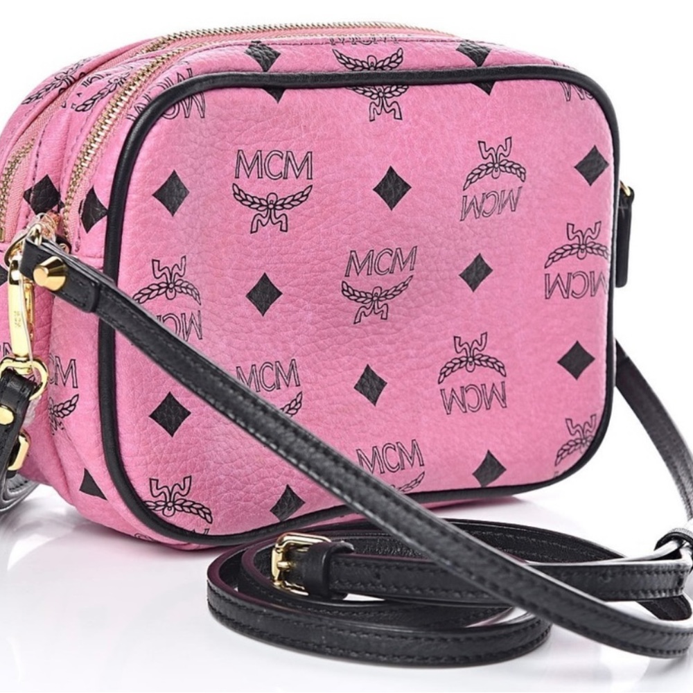 A pink and black MCM small bag